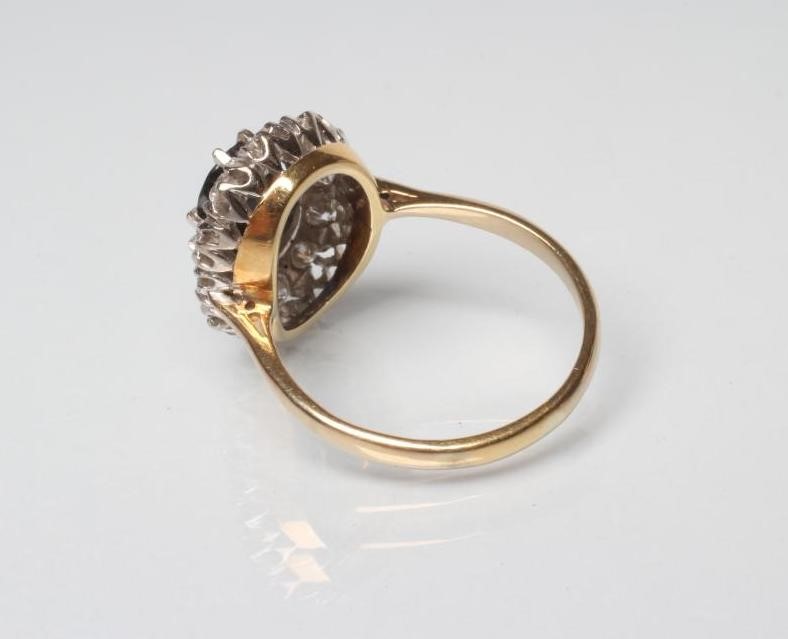 A SAPPHIRE AND DIAMOND CLUSTER RING Image