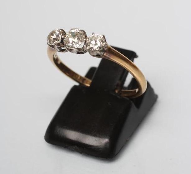 A THREE STONE DIAMOND RING Image