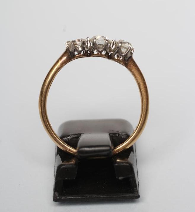 A THREE STONE DIAMOND RING Image