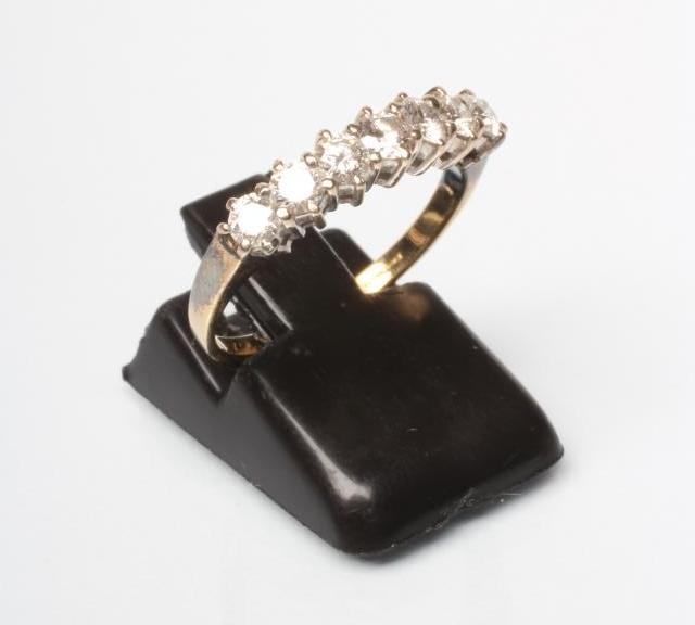 A SEVEN STONE DIAMOND RING Image