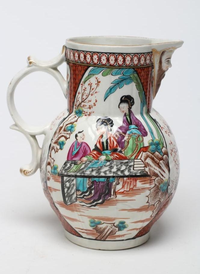 A FIRST PERIOD WORCESTER PORCELAIN CABBAGE LEAF MOULDED MASK JUG Image