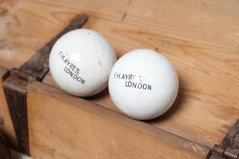 A SET OF EIGHT LIGNUM VITAE LAWN BOWLING BALLS together with a pair of Jacks Image