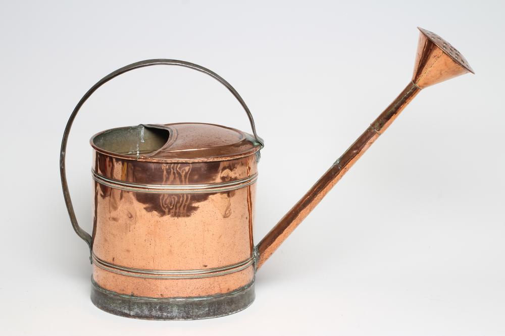 A LARGE COPPER WATERING CAN Image