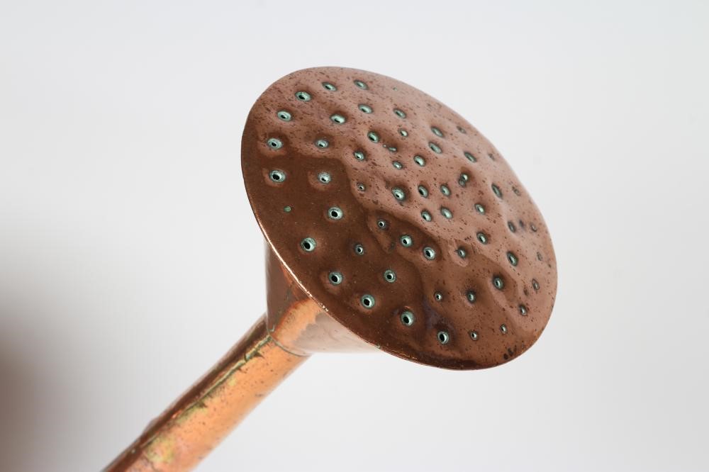 A LARGE COPPER WATERING CAN Image