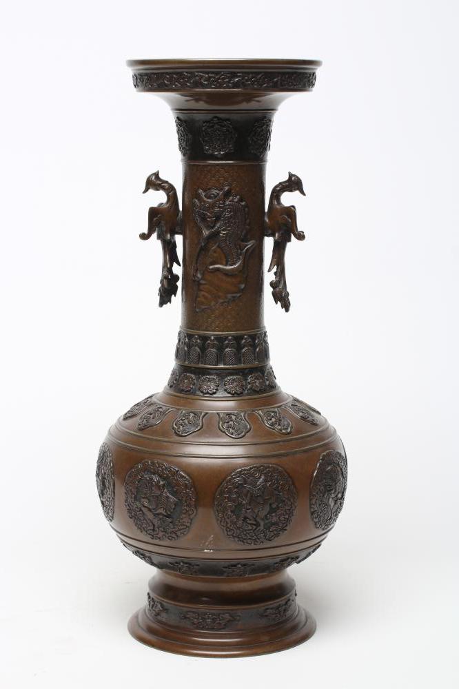 A JAPANESE BRONZE VASE of baluster form with cast and applied dragon handles and panels of mythical Image