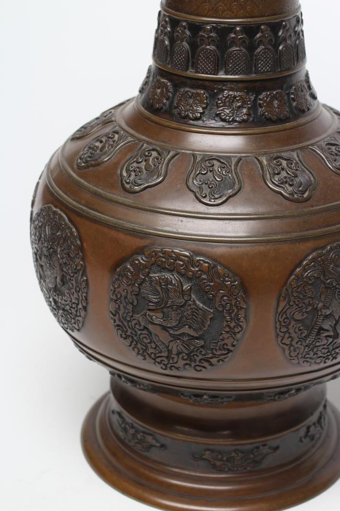 A JAPANESE BRONZE VASE of baluster form with cast and applied dragon handles and panels of mythical Image