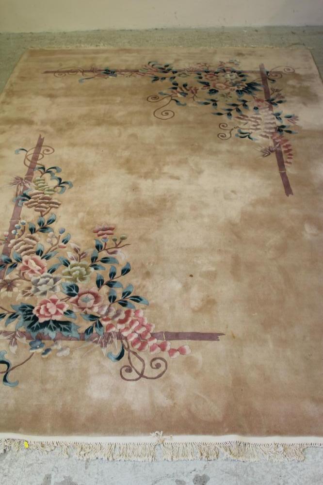 A CHINESE WASHED AND FRINGED CARPET Image