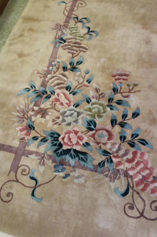 A CHINESE WASHED AND FRINGED CARPET Image