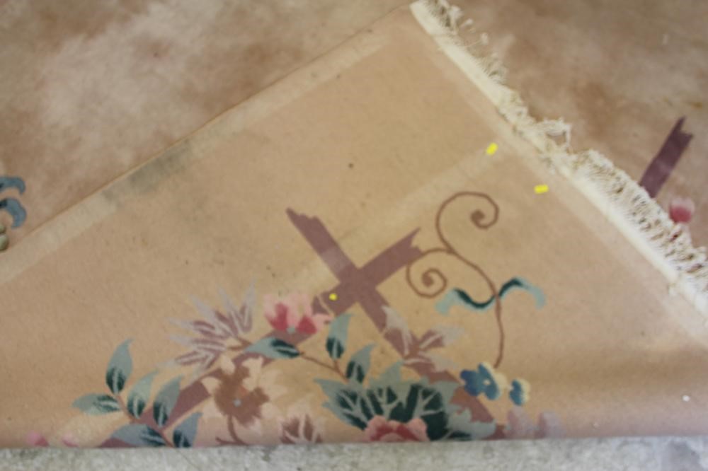 A CHINESE WASHED AND FRINGED CARPET Image