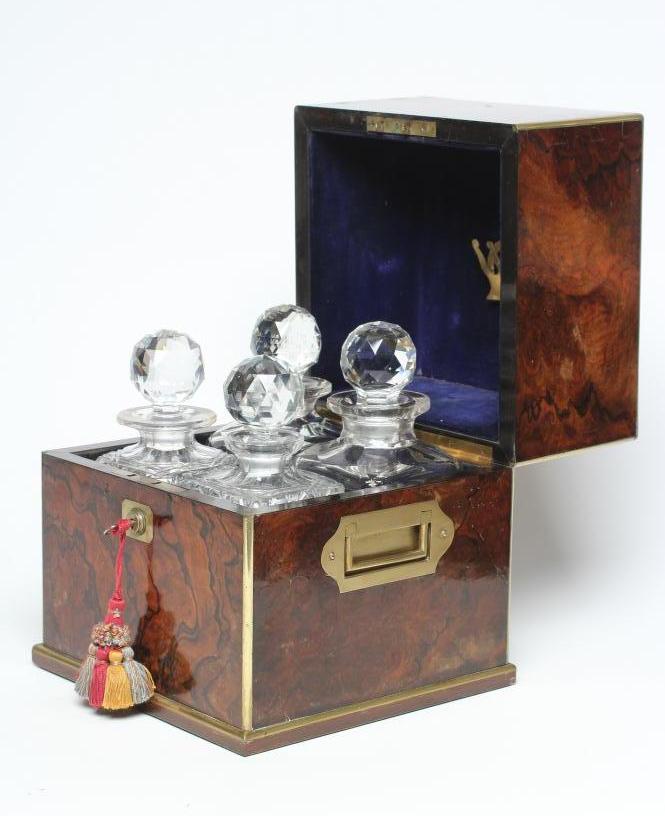 AN EARLY VICTORIAN BURR WALNUT DECANTER BOX of square form with brass mounts and campaign handles Image