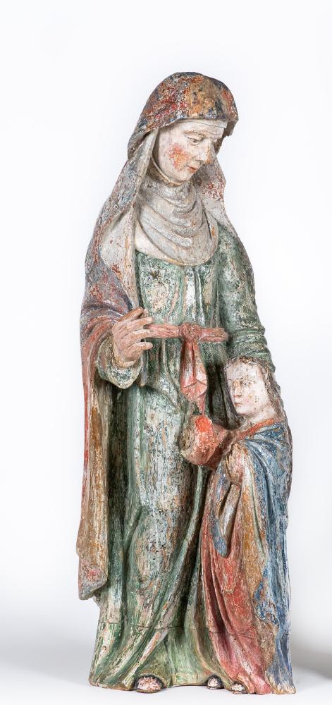A CARVED WOOD AND POLYCHROME PAINTED FIGURE OF A FEMALE SAINT Image