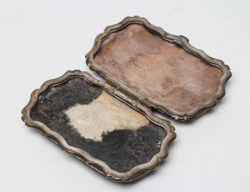 A VICTORIAN TORTOISESHELL PURSE of rounded oblong form with silver pique scroll work enclosing Image