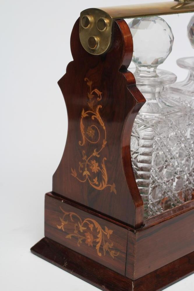 A LATE VICTORIAN ROSEWOOD AND FOLIATE MARQUETRY TANTALUS Image