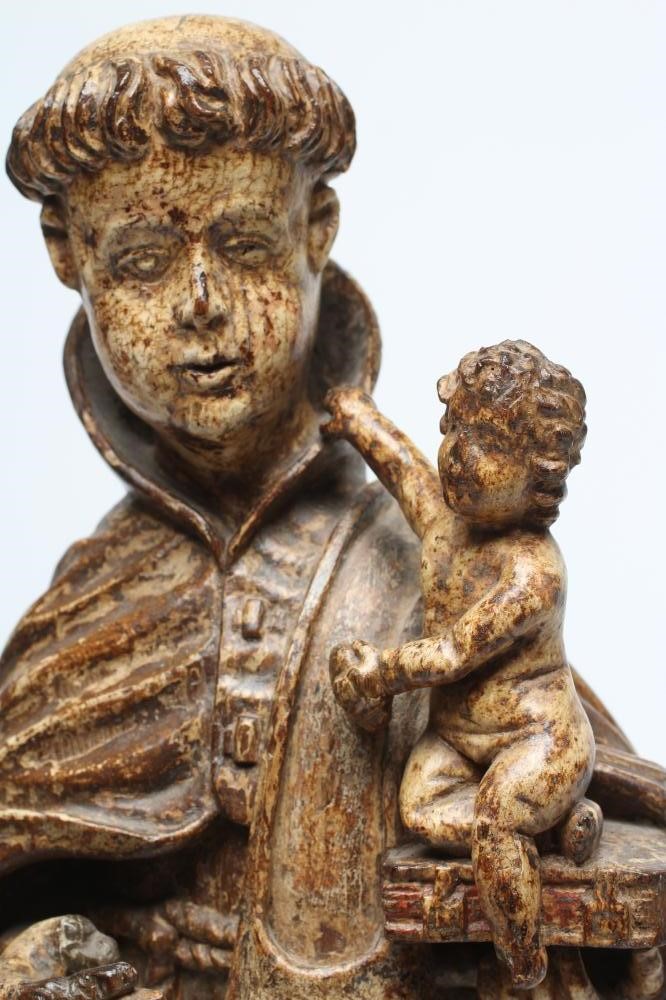 A CARVED WOOD AND PAINTED FIGURE OF ST ANTHONY OF PADUA Image