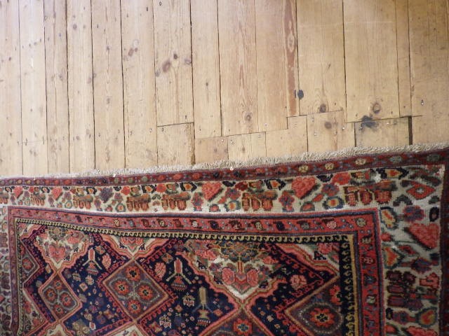A WEST PERSIAN TRIBAL RUG Image