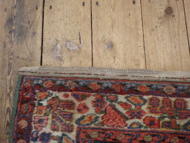 A WEST PERSIAN TRIBAL RUG Image