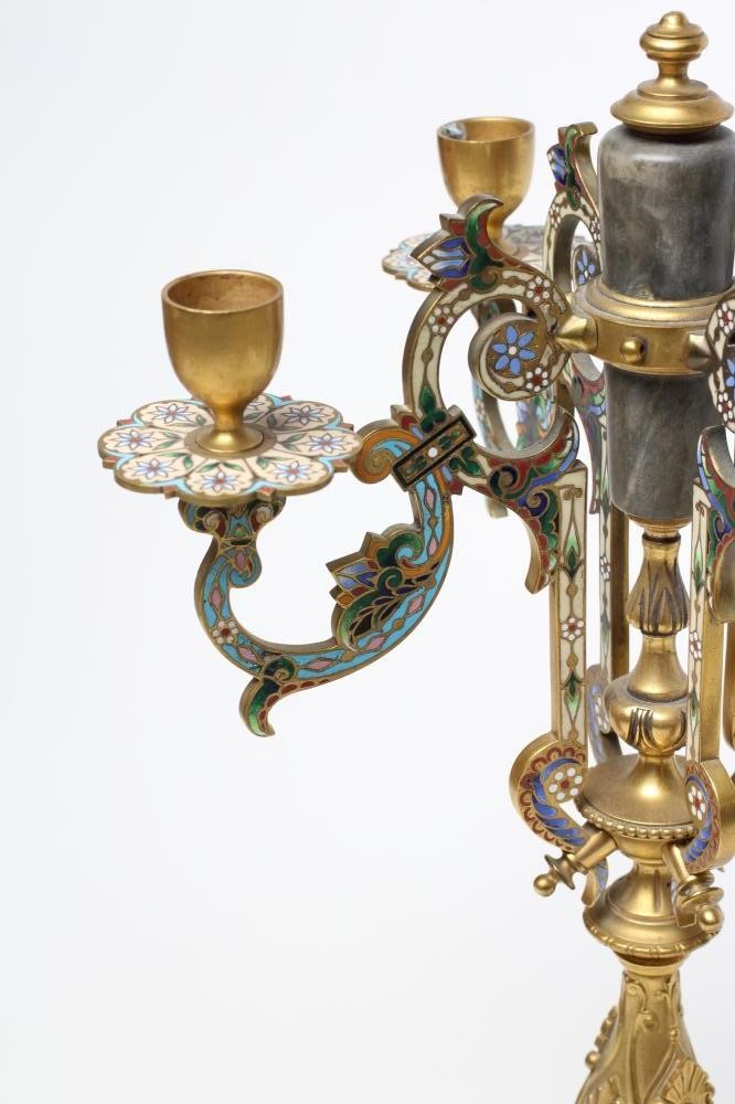 A GILDED BRASS AND GREY ONYX CHAMPLEVE ENAMEL CANDELABRUM Image