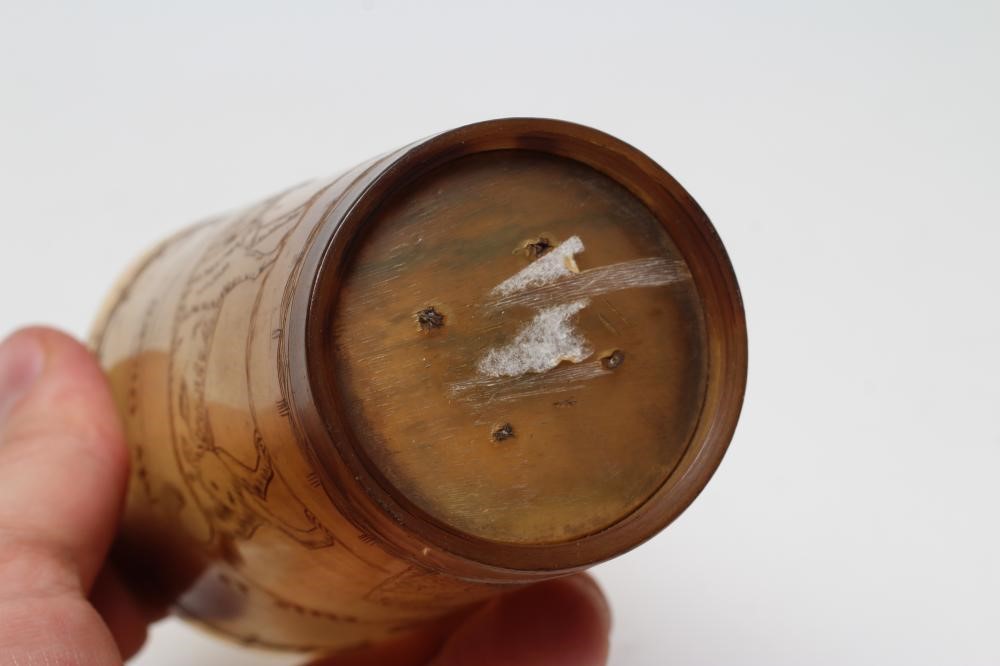 A GEORGIAN HORN BEAKER engraved with a bust portrait of a lady wearing a plumed hat and a dog Image