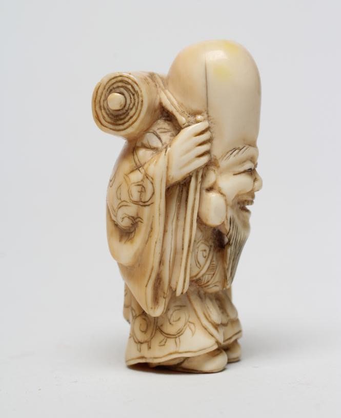A JAPANESE IVORY NETSUKE Image