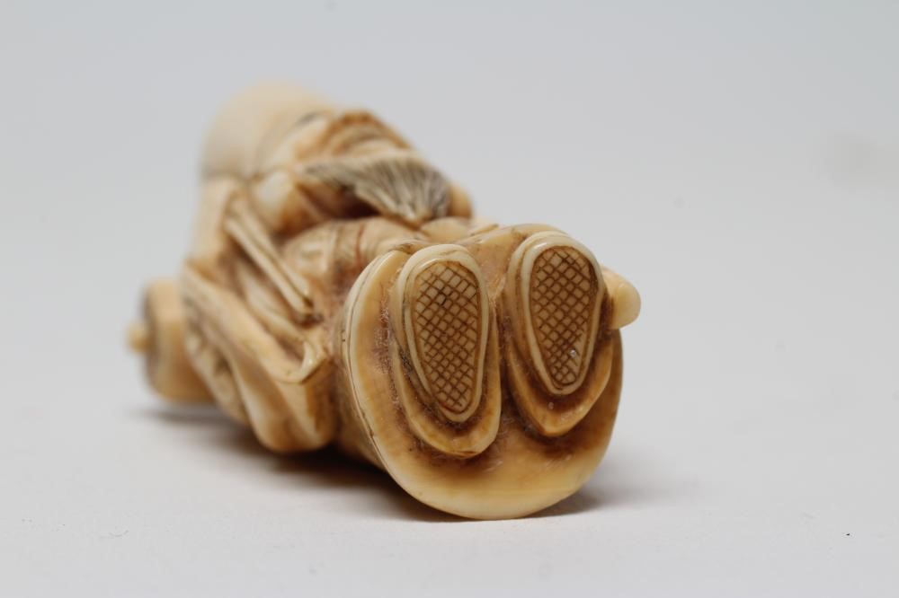 A JAPANESE IVORY NETSUKE Image