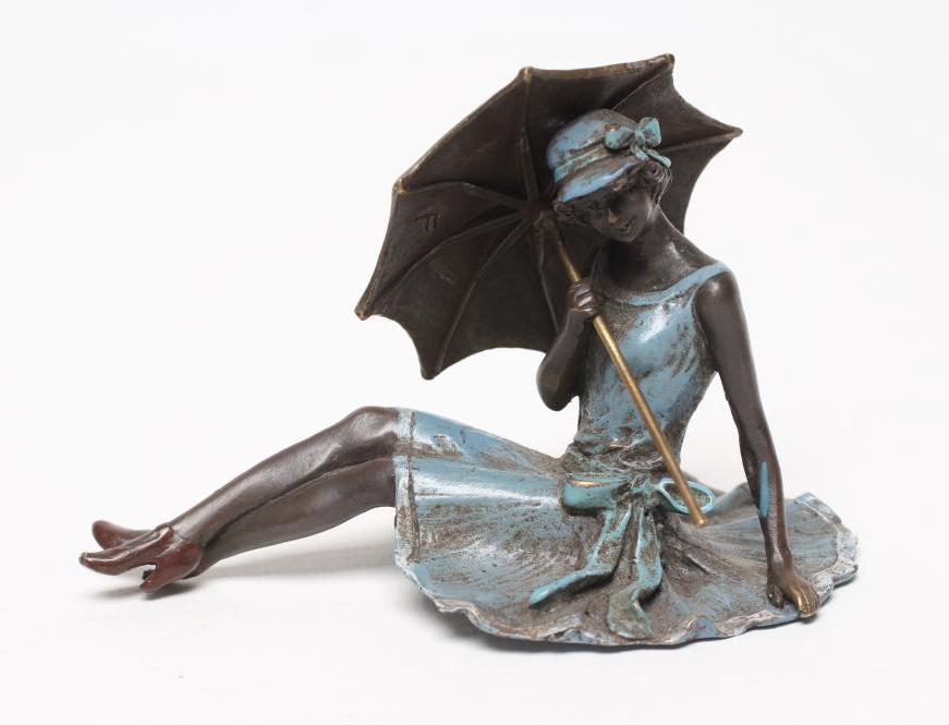 AN EROTIC BRONZE FIGURE modelled as a young lady in 1920's style blue enamelled dress and hat Image