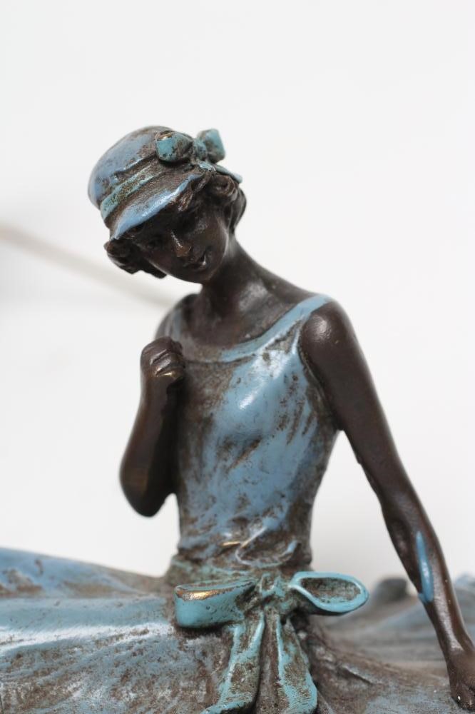 AN EROTIC BRONZE FIGURE modelled as a young lady in 1920's style blue enamelled dress and hat Image