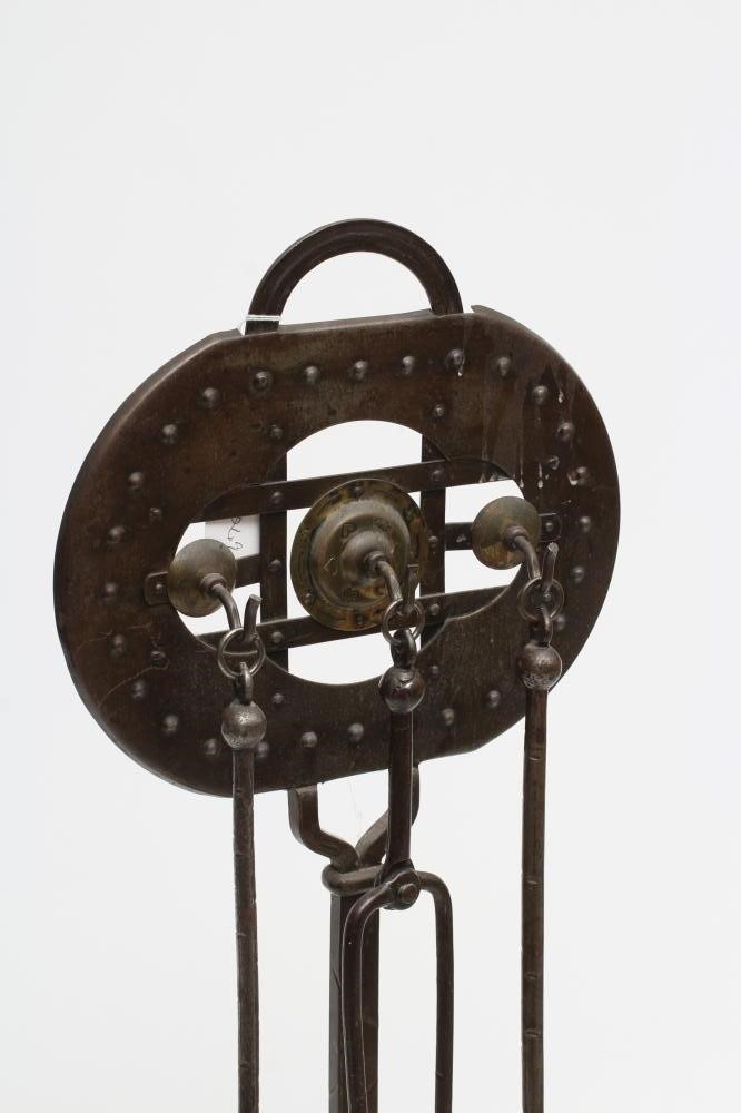 A GOBERG (HUGO BERGER) JUGENDSTIL SHEET METAL COMPANION SET with hammered finish and decorative stud Image