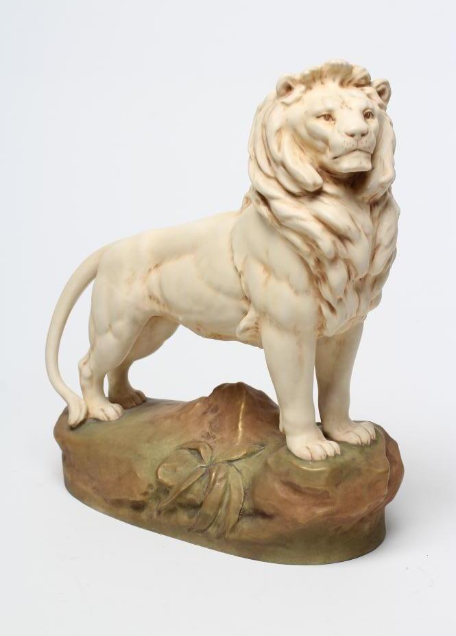 A ROYAL DUX BISQUE PORCELAIN LION Image