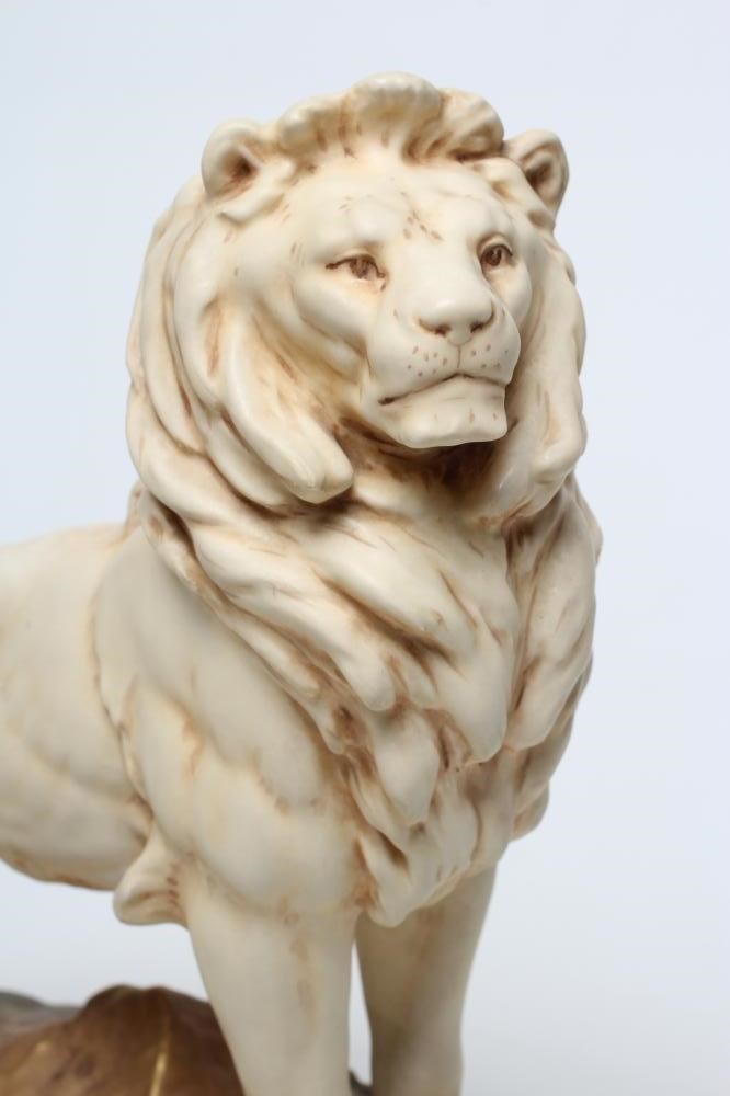 A ROYAL DUX BISQUE PORCELAIN LION Image
