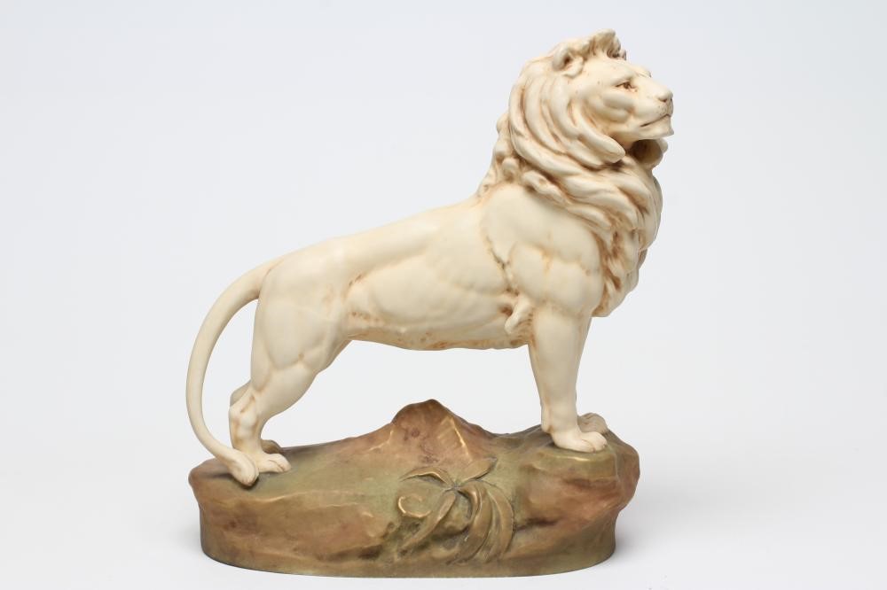 A ROYAL DUX BISQUE PORCELAIN LION Image