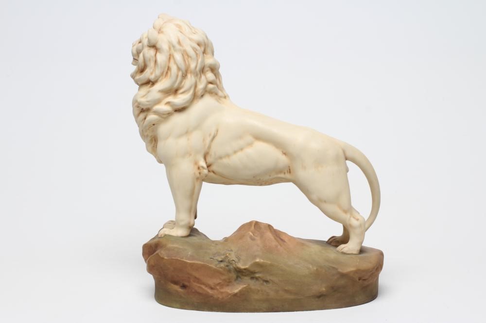 A ROYAL DUX BISQUE PORCELAIN LION Image