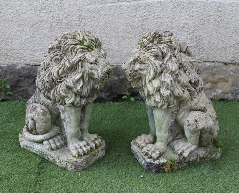 A PAIR OF COMPOSITE STONE LIONS SEJANT Image