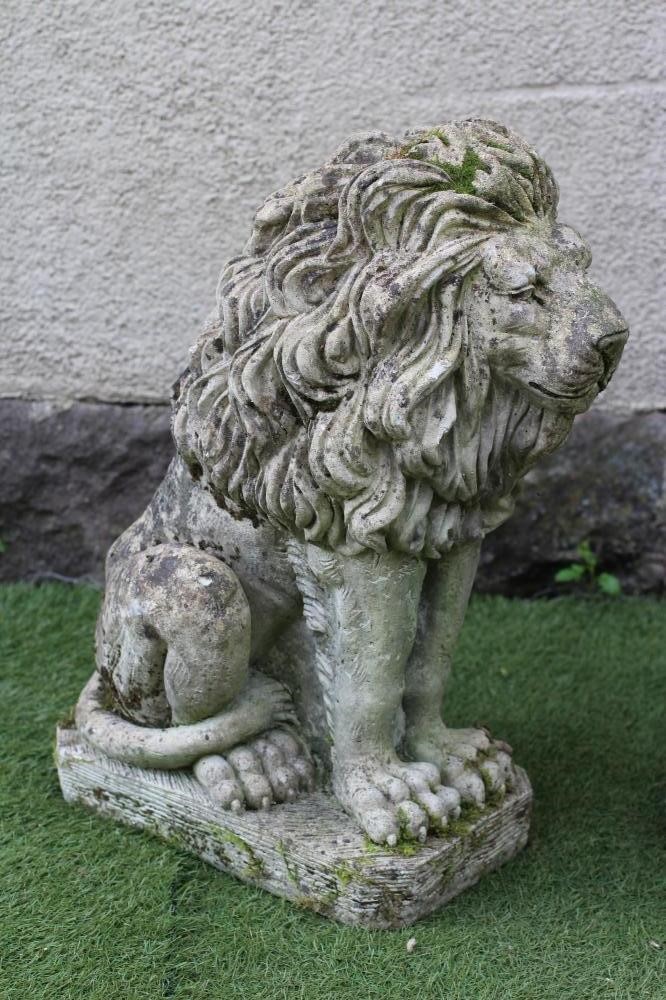A PAIR OF COMPOSITE STONE LIONS SEJANT Image