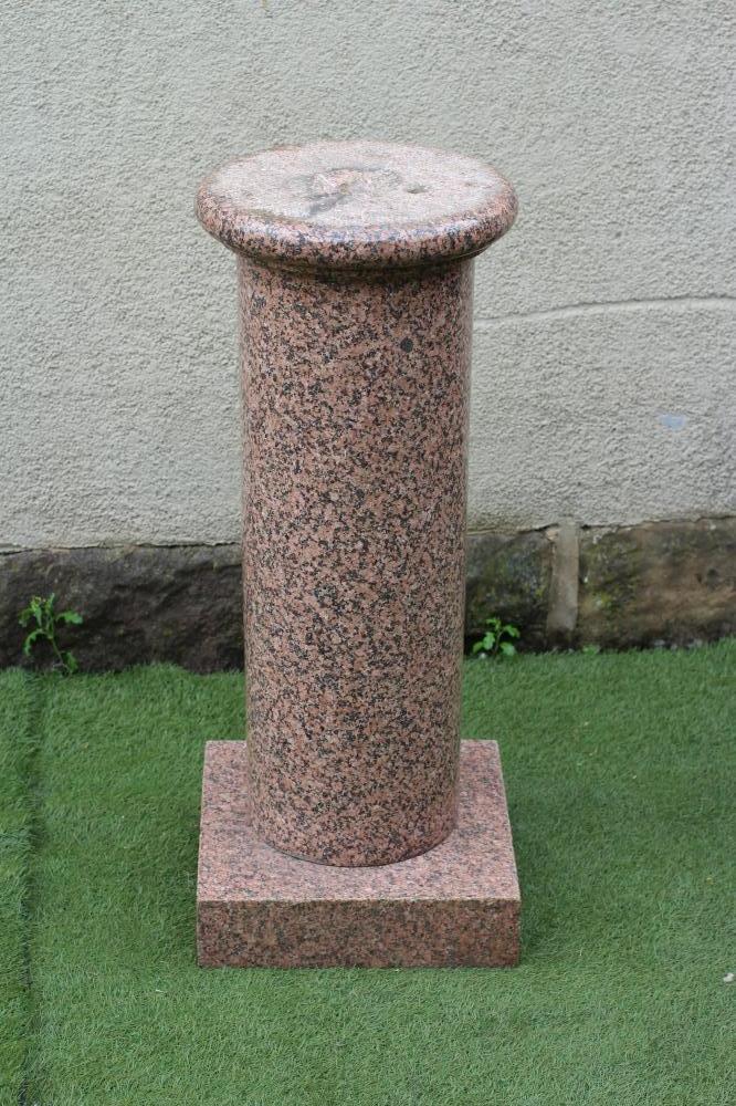 A PINK GRANITE STAND Image