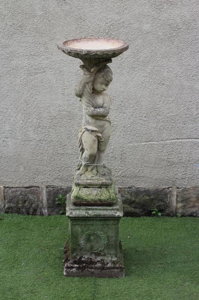 A COMPOSITE STONE BIRD BATH Image