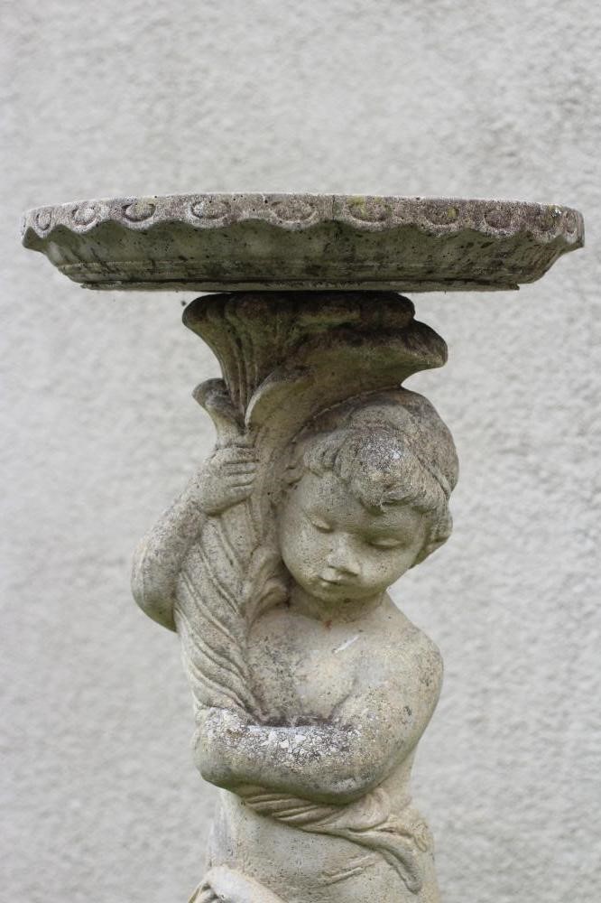 A COMPOSITE STONE BIRD BATH Image