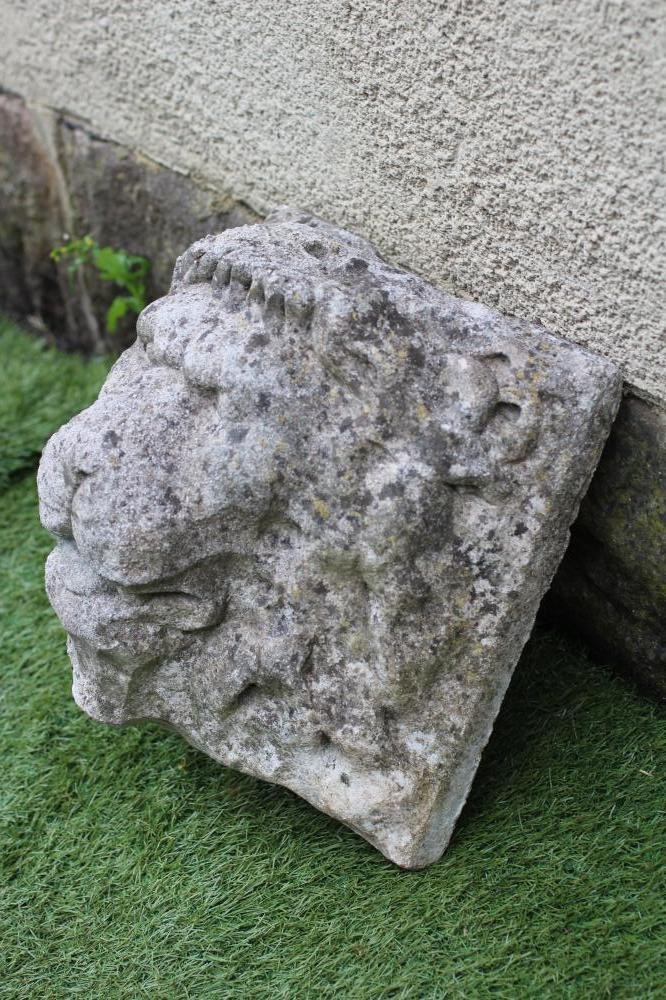 A CARVED STONE LION HEAD WALL FOUNTAIN Image