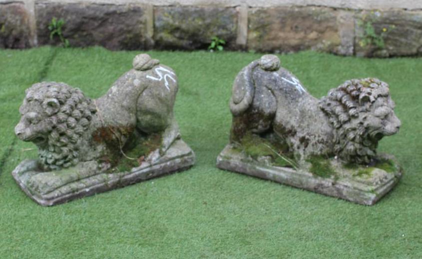 A PAIR OF COMPOSITE STONE LIONS COUCHANT Image