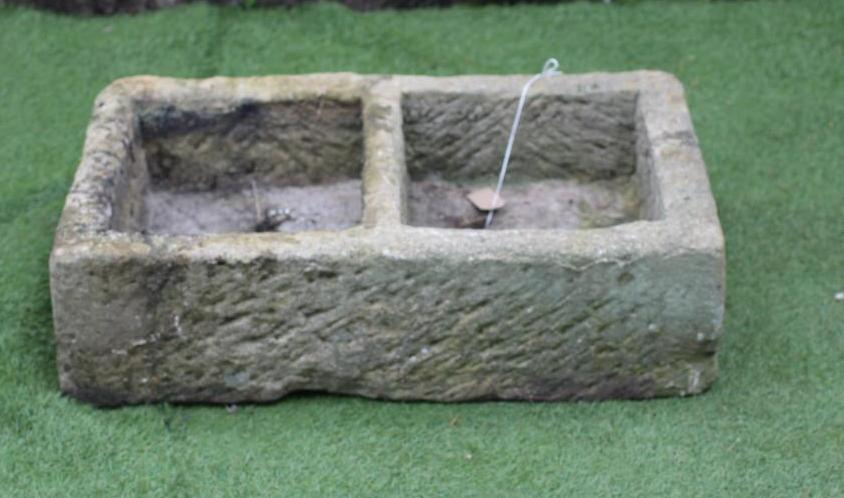 A SANDSTONE TROUGH of well cut oblong form with central division Image