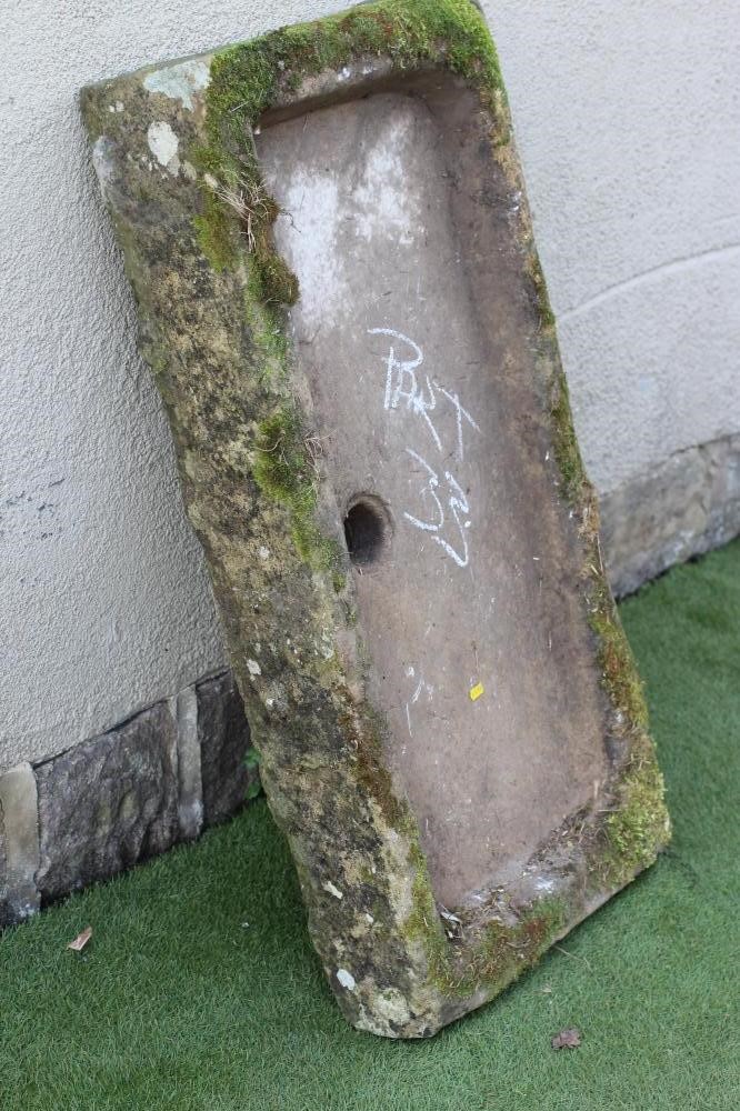 A SANDSTONE TROUGH of well cut oblong form with central division Image