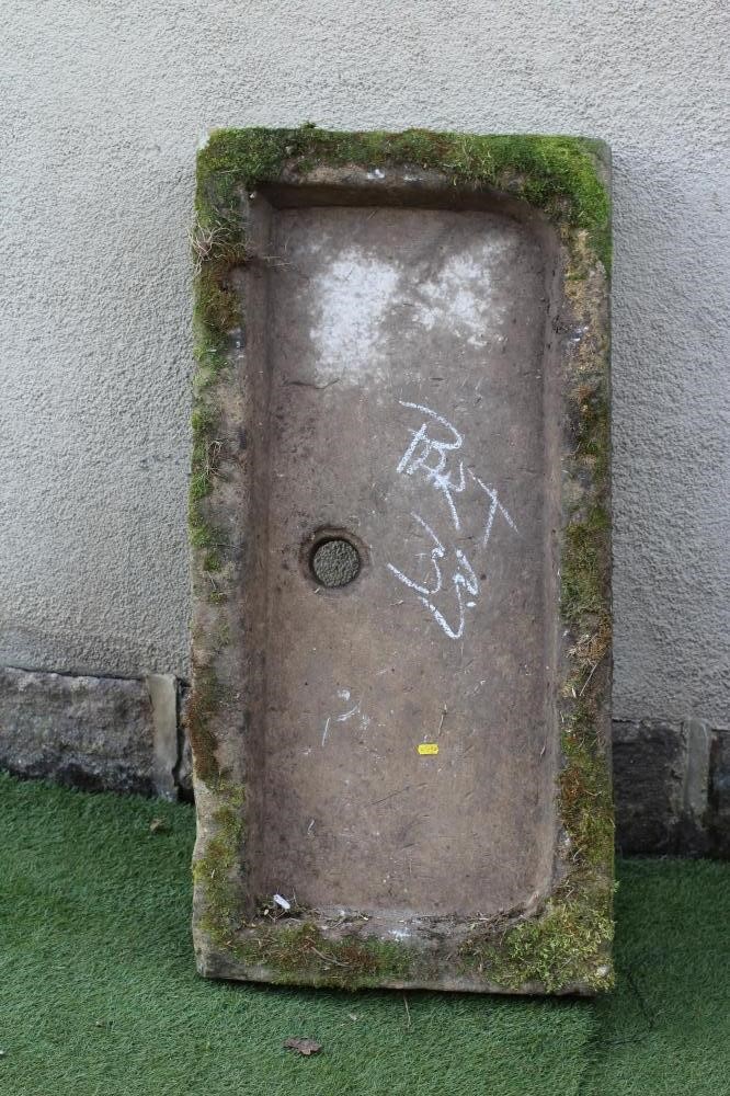 A SANDSTONE TROUGH of well cut oblong form with central division Image