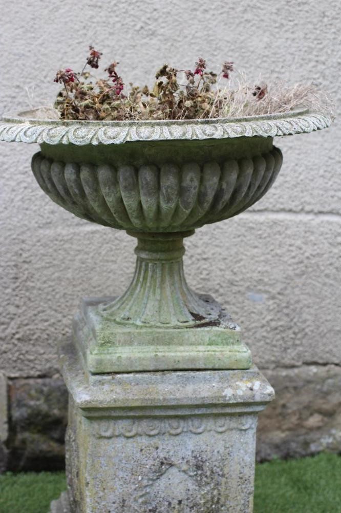 A COMPOSITE STONE URN Image