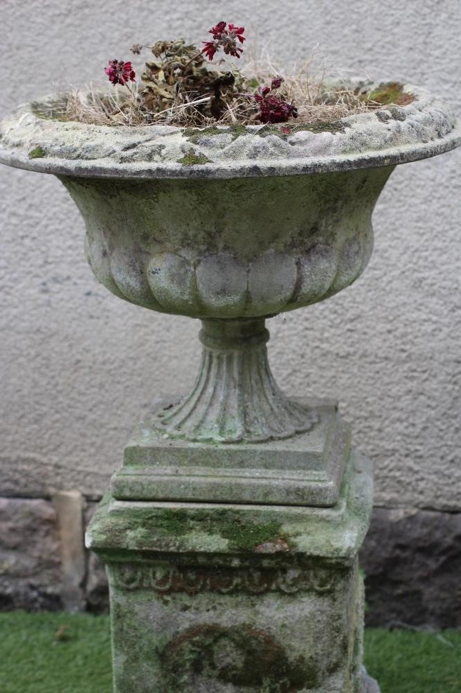 A COMPOSITE STONE URN Image