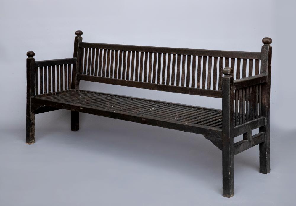 AN ARTS AND CRAFTS WOODEN BENCH of painted slatted form Image