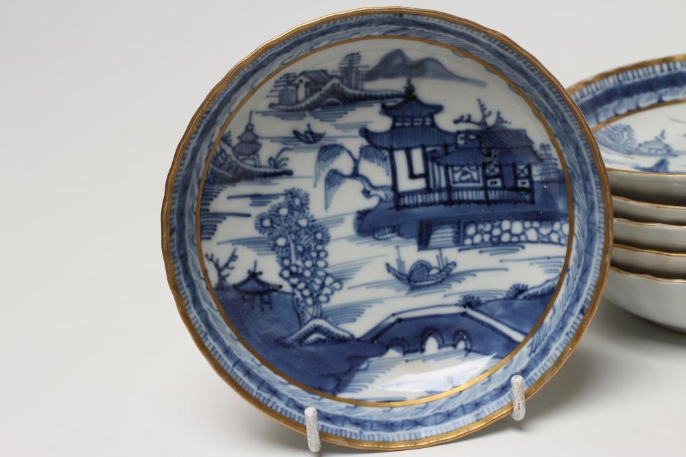 A SET OF SIX CHINESE PORCELAIN RIBBED TEABOWLS AND SAUCERS painted in underglaze blue with a Image