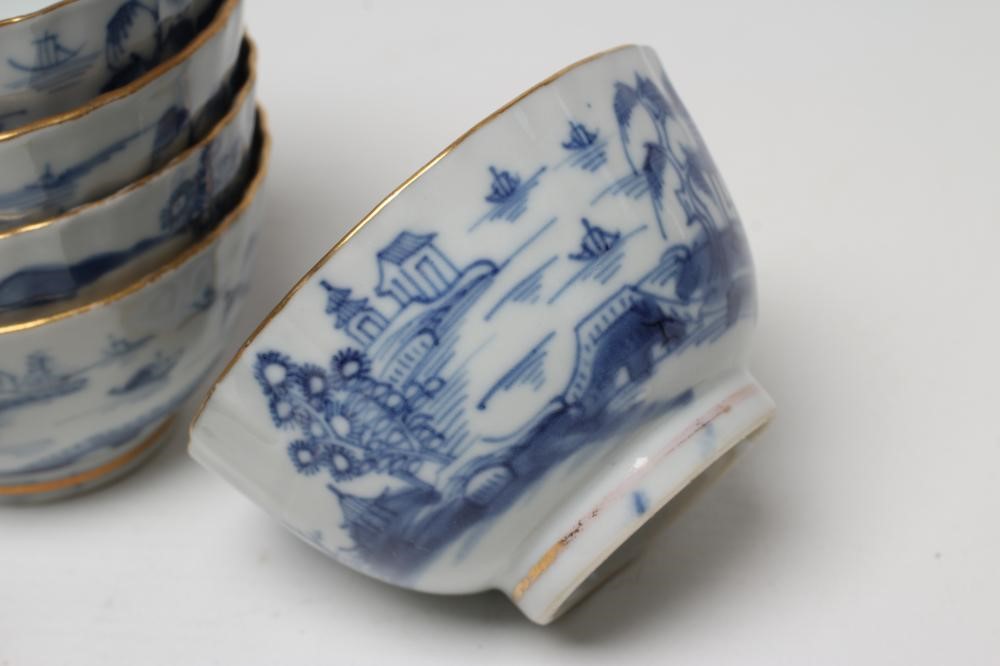 A SET OF SIX CHINESE PORCELAIN RIBBED TEABOWLS AND SAUCERS painted in underglaze blue with a Image