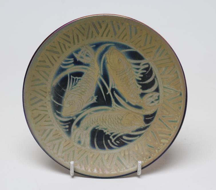 A BURMANTOFTS FAIENCE PLATE of plain circular form painted by J. Walmsley in iridescent Image