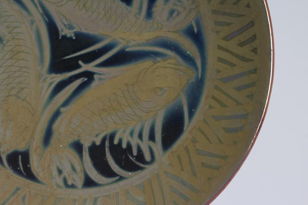 A BURMANTOFTS FAIENCE PLATE of plain circular form painted by J. Walmsley in iridescent Image
