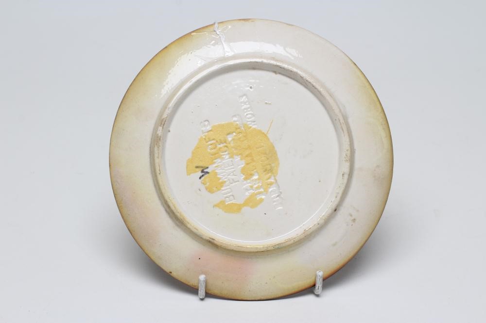 A BURMANTOFTS FAIENCE PLATE of plain circular form painted by J. Walmsley in iridescent Image