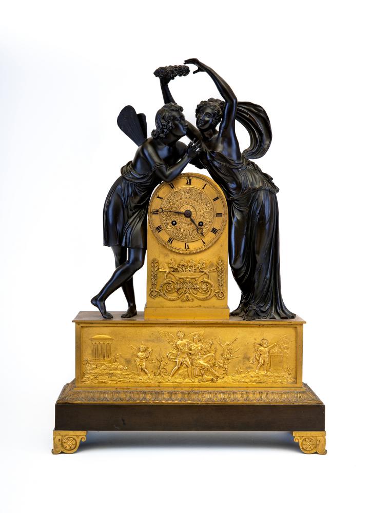 A FRENCH EMPIRE PATINATED AND GILT BRONZE MANTEL CLOCK Image